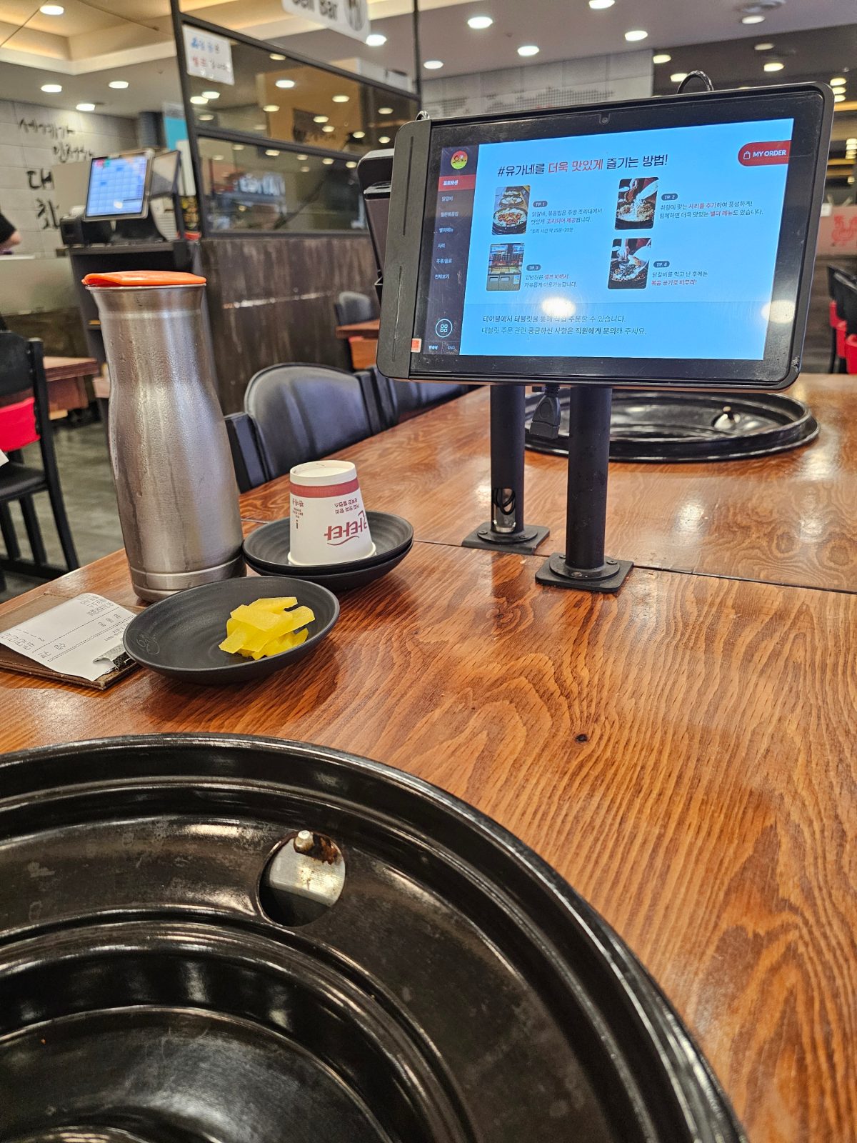 Table ordering setup and grill table at Yugane Dakgalbi Daegu Dongseongro