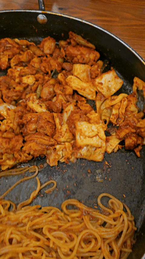 Hot pan of spicy dakgalbi and noodle add-on at Yugane Dakgalbi Daegu