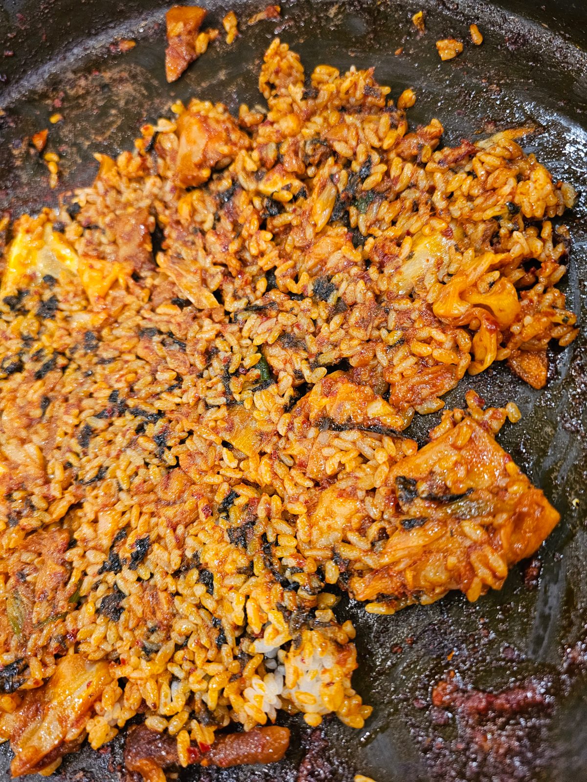 Close-up of spicy bokkeumbap fried rice in a dakgalbi pan
