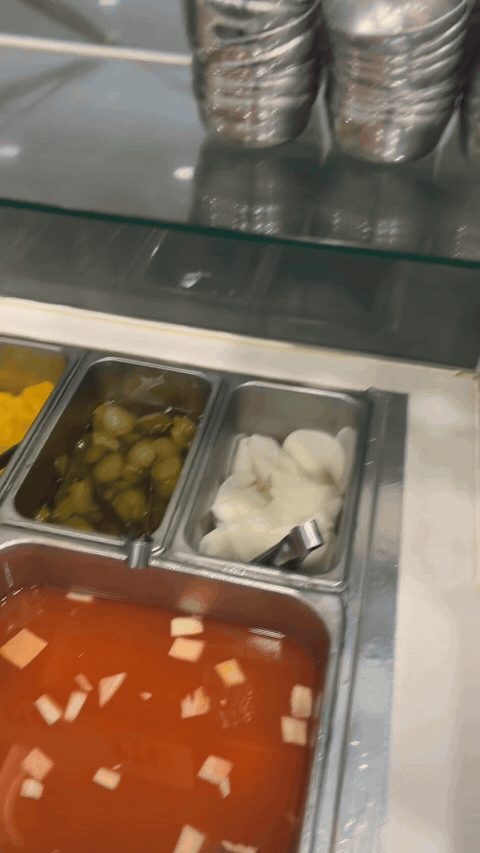 Self-service counter with soup and side dishes at Yugane Dakgalbi Daegu