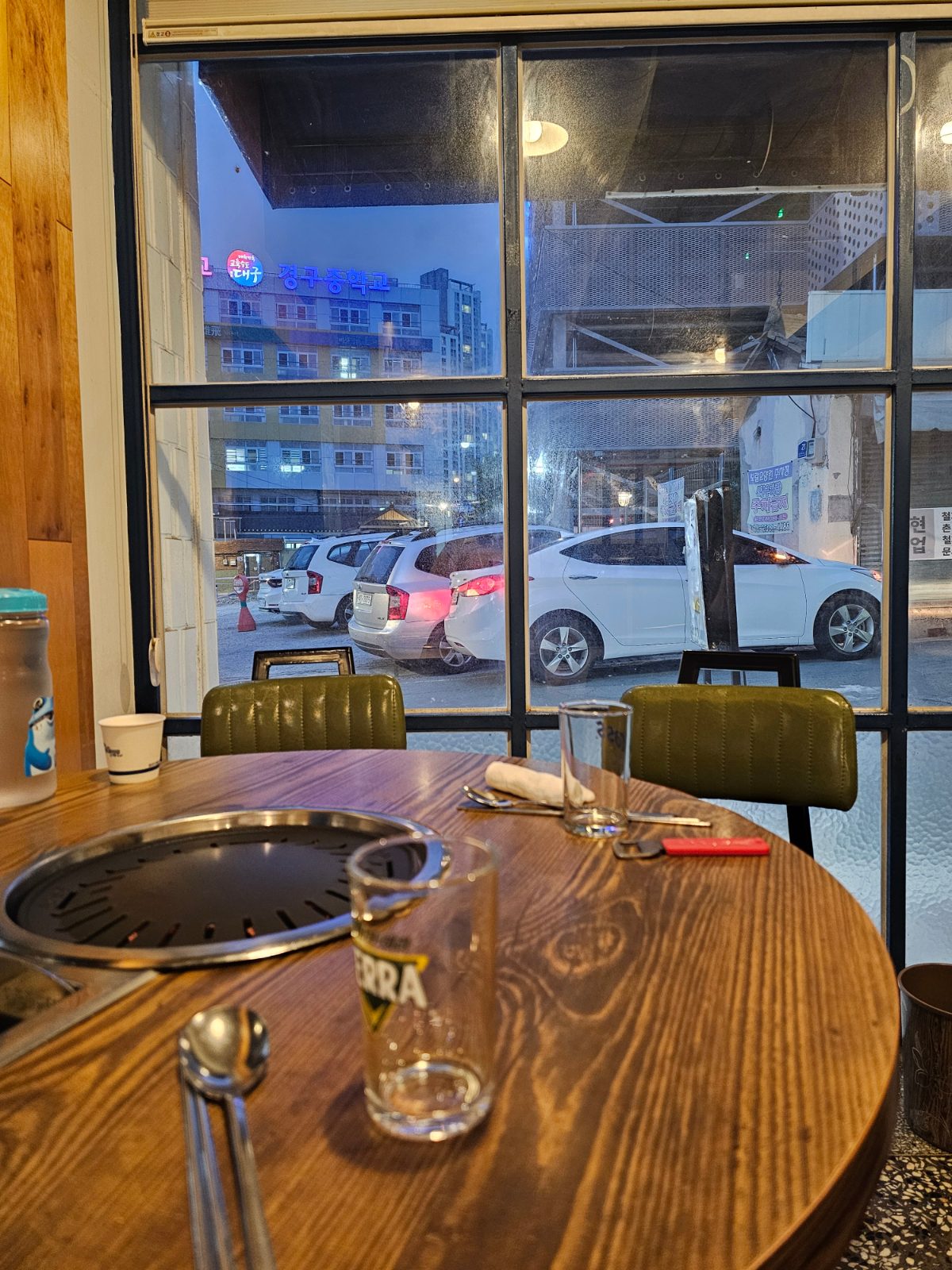 Dining area with full-height windows and an open view